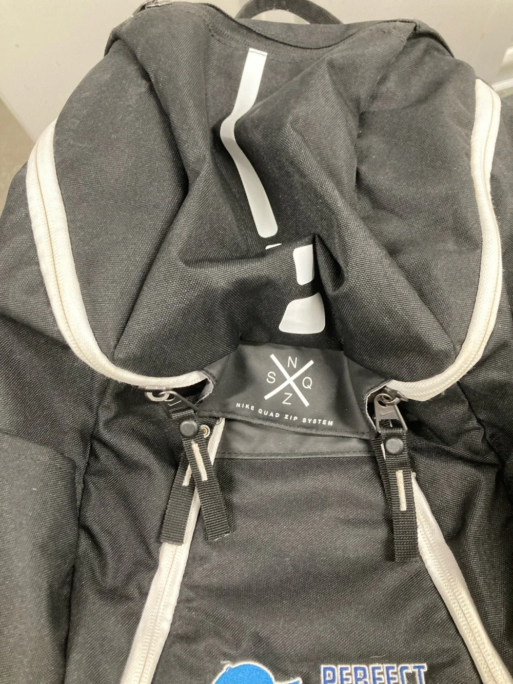 Nike Black Backpack with White Trim and Blue Logo